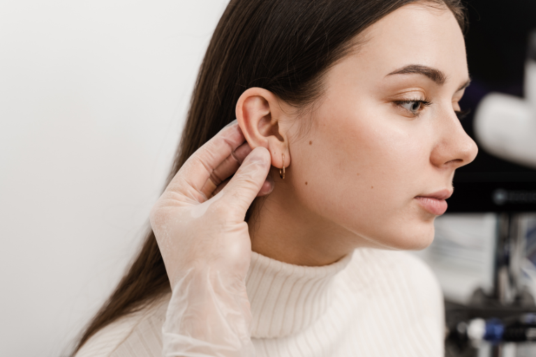 Woman getting ear looked at